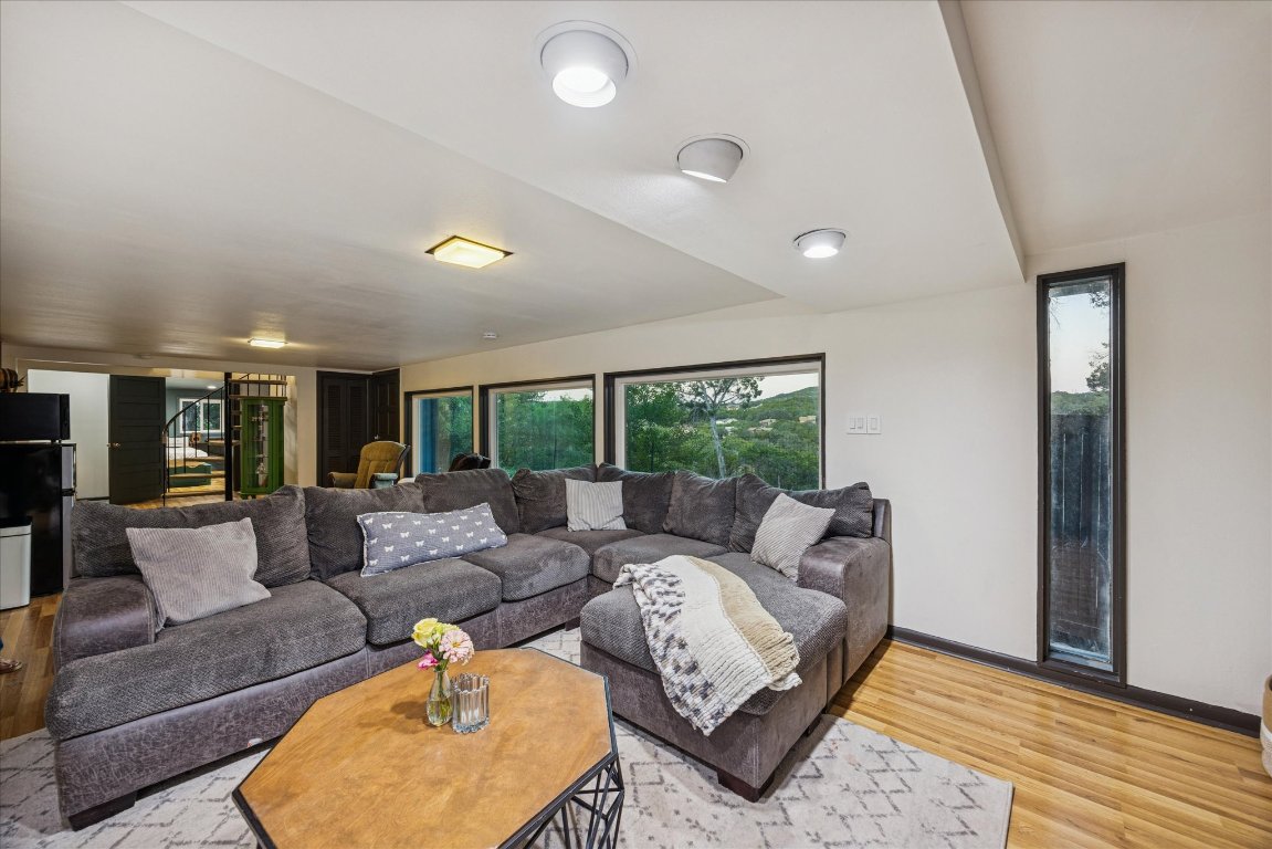 6407 Lynn Lane Lago Vista, TX 78645 - Photo 23 of 32 a living room with furniture and a large window