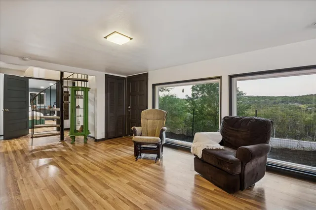 a living room with furniture and a large window