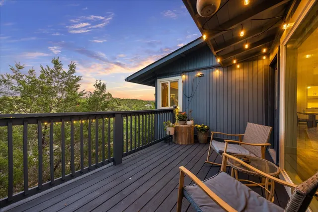 a view of a balcony with chairs