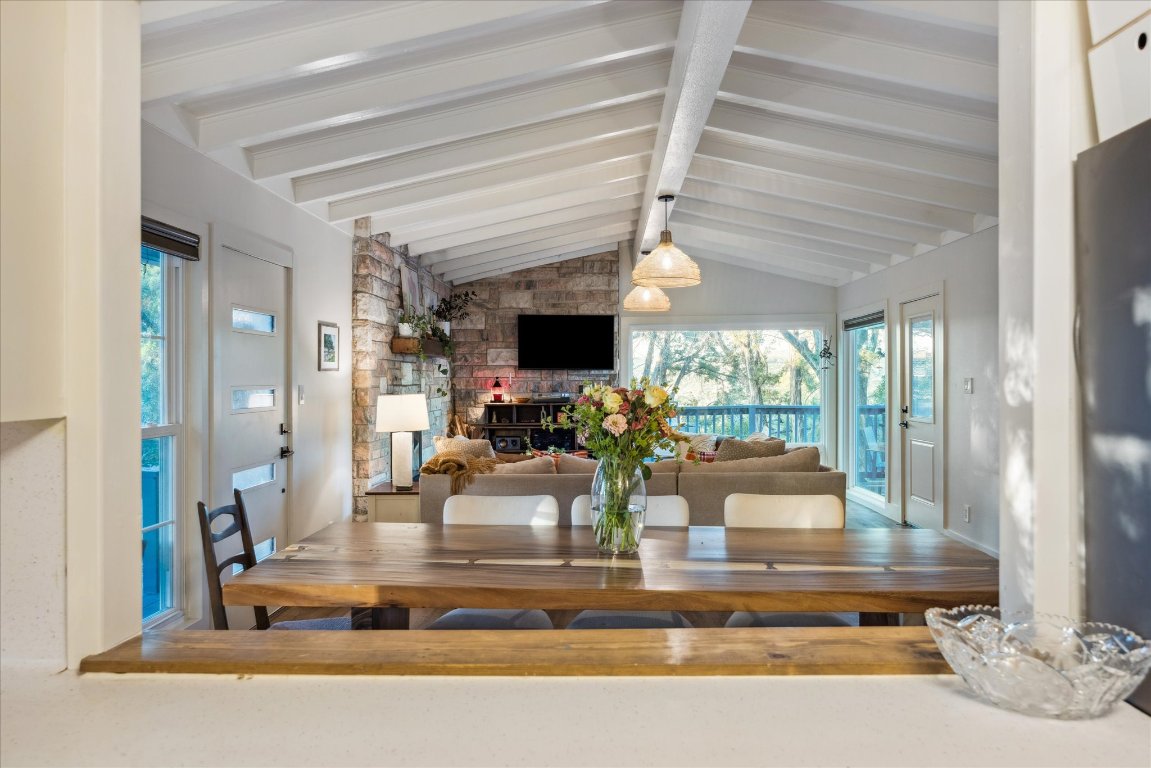 6407 Lynn Lane Lago Vista, TX 78645 - Photo 8 of 32 a view of a living room with fireplace furniture and a large window