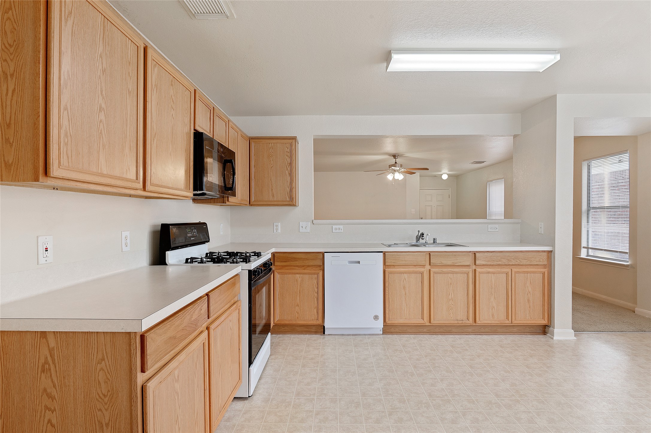 29522 Legends Stone Drive Spring, TX 77386 - Photo 6 of 17 a kitchen with stainless steel appliances granite countertop a sink stove and cabinets