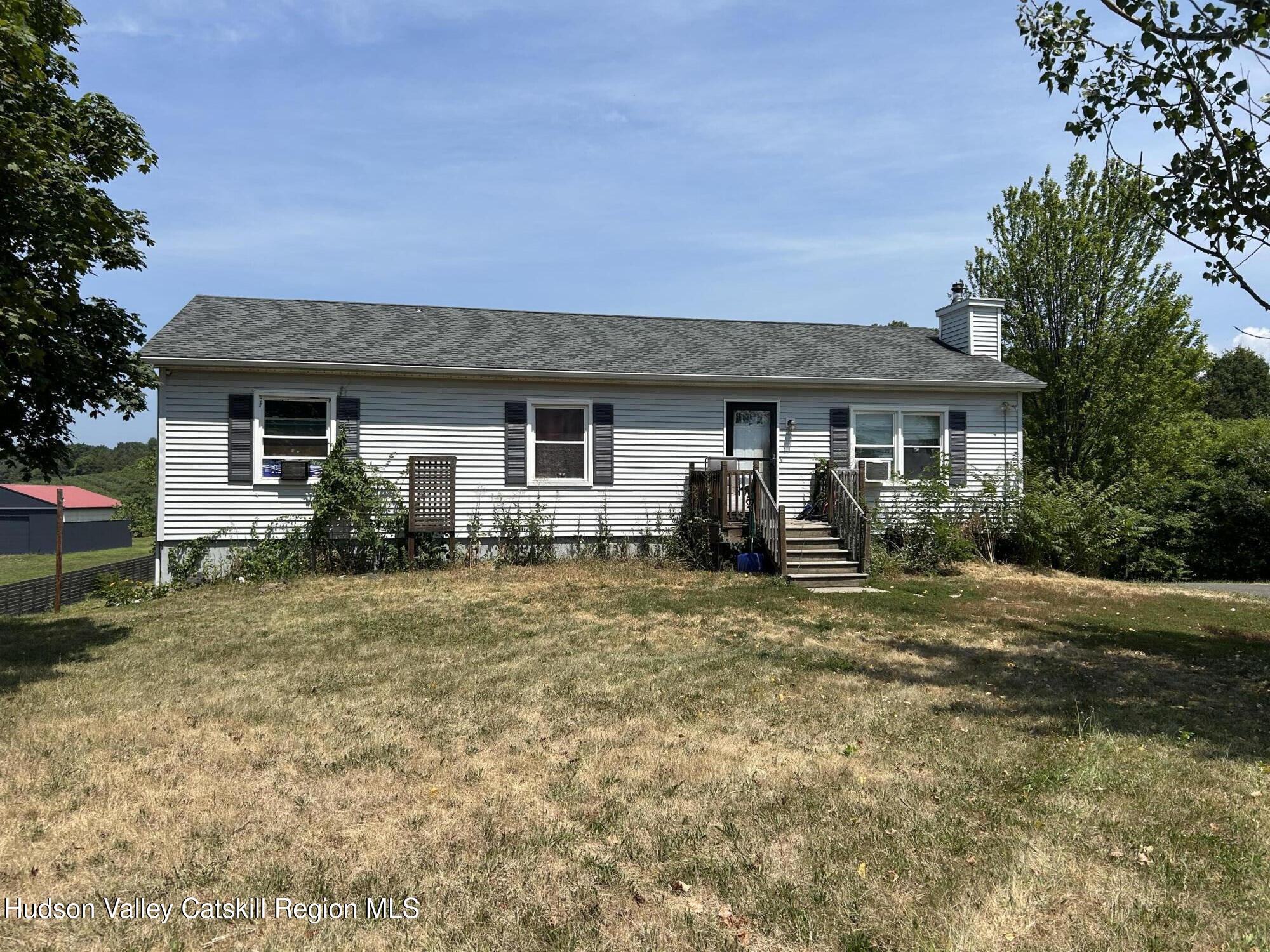 a front view of a house with yard