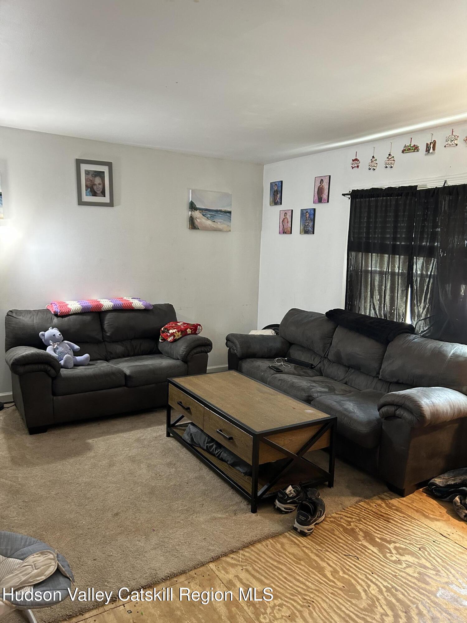 229 Cold Spring Road Hudson, NY 12534 - Photo 3 of 14 a living room with furniture and a window
