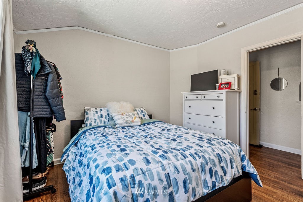 2030 Maple Street, Unit 16 Longview, WA 98632 - Photo 24 of 31 a bedroom with a bed and a flat tv screen on a dresser
