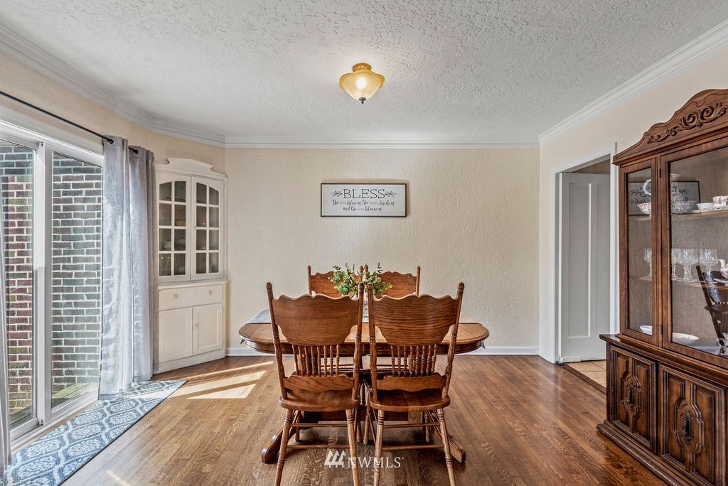 2030 Maple Street, Unit 16 Longview, WA 98632 - Photo 9 of 31 a view of a dining room with furniture and chandelier