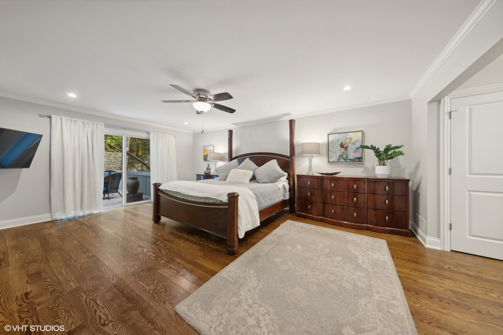 6 Bel Aire Court Burr Ridge, IL 60527 - Photo 14 of 37 a spacious bedroom with a bed a window and dresser