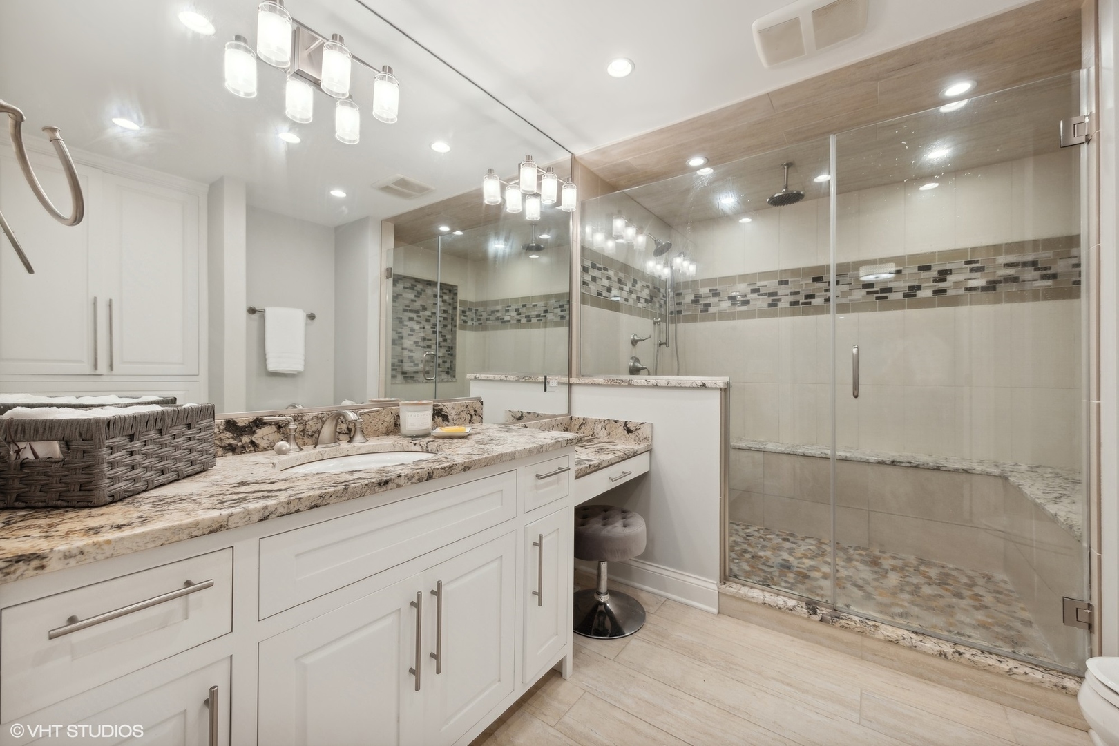 6 Bel Aire Court Burr Ridge, IL 60527 - Photo 17 of 37 a bathroom with a granite countertop sink a large mirror and shower