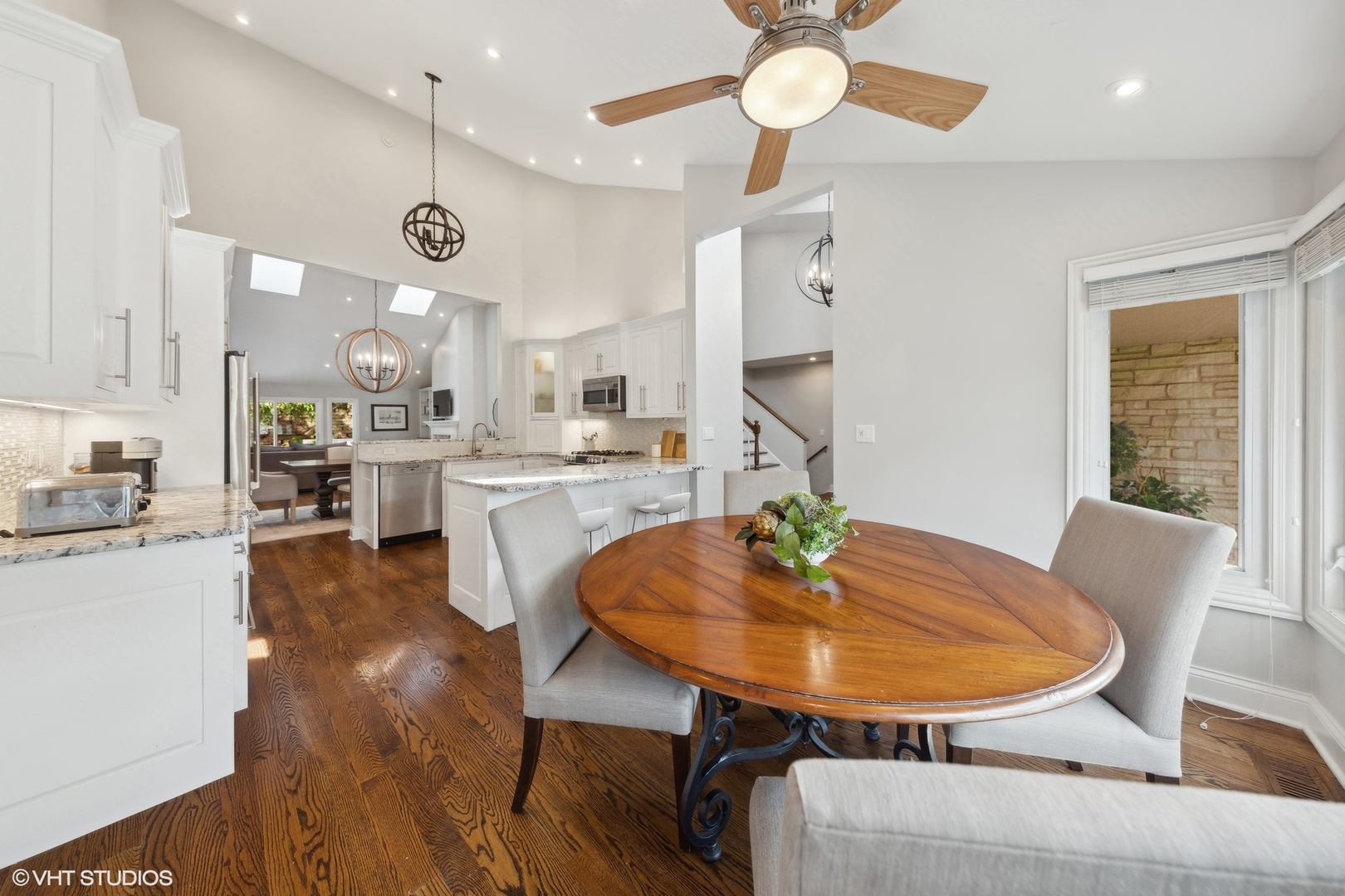 6 Bel Aire Court Burr Ridge, IL 60527 - Photo 5 of 37 an open kitchen with a table and chairs