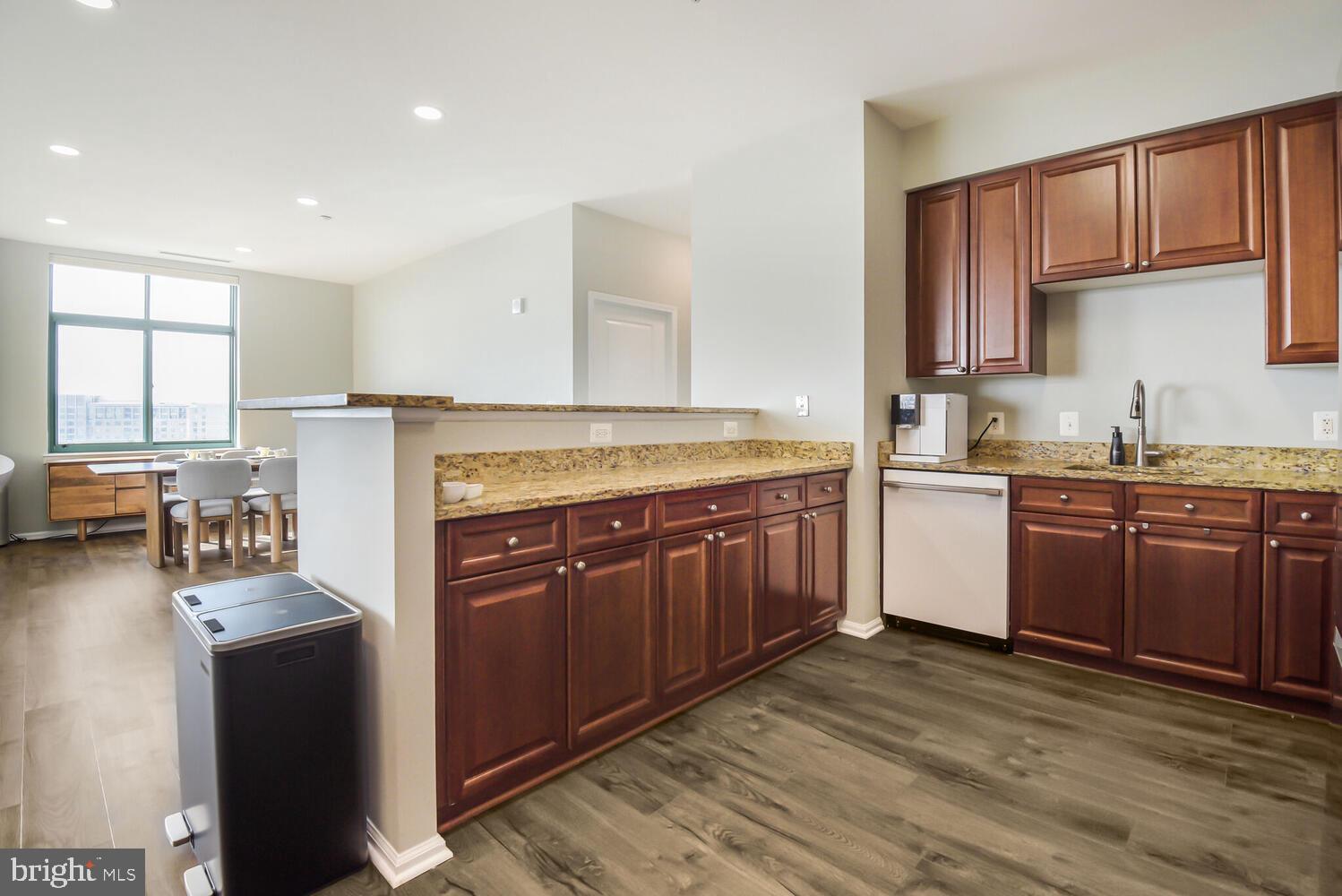 11700 Old Georgetown Road, Unit 1604 North Bethesda, MD 20852 - Photo 11 of 41 a kitchen with a stove a sink a refrigerator a window