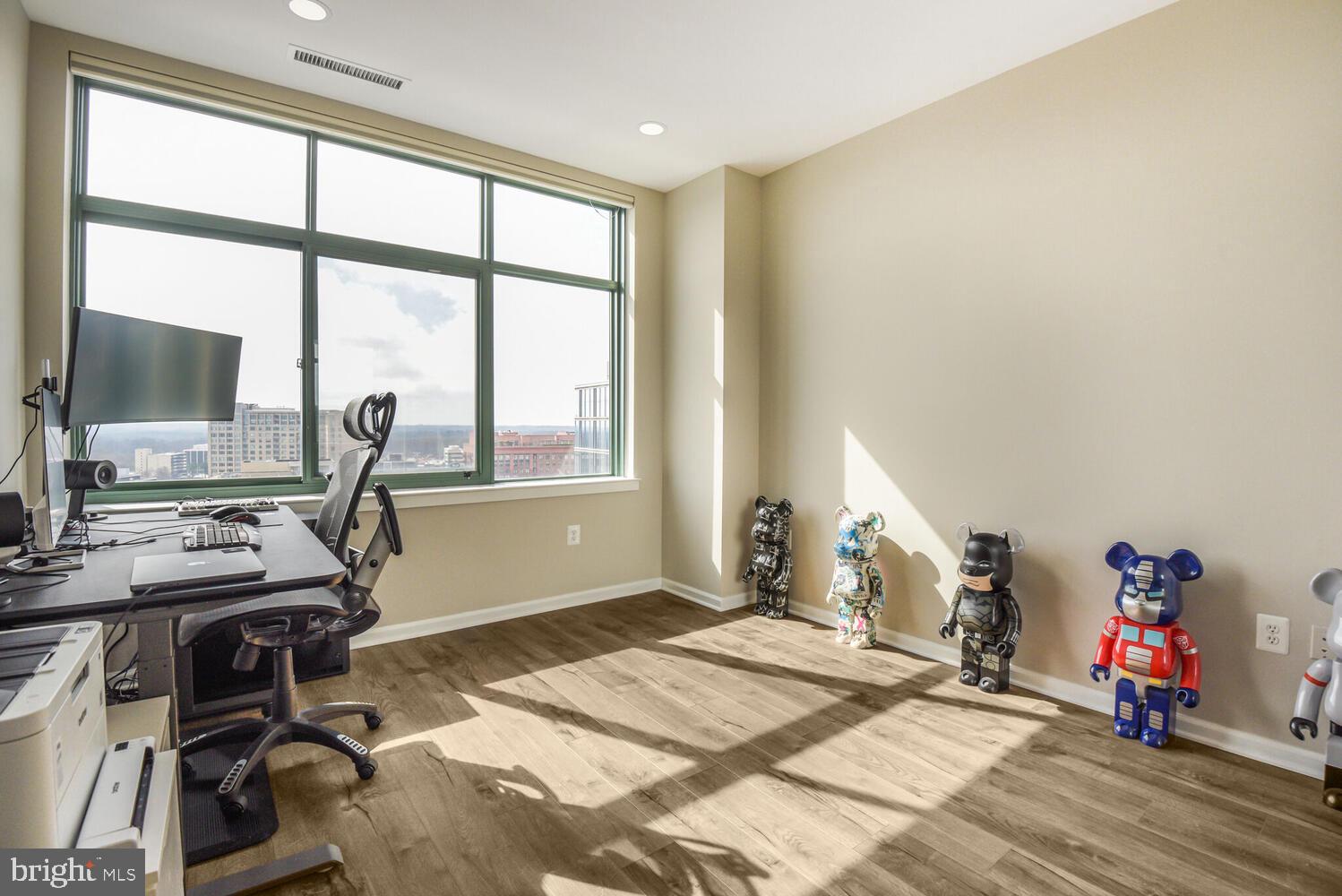 11700 Old Georgetown Road, Unit 1604 North Bethesda, MD 20852 - Photo 20 of 41 a bedroom with a bed and a flat screen tv
