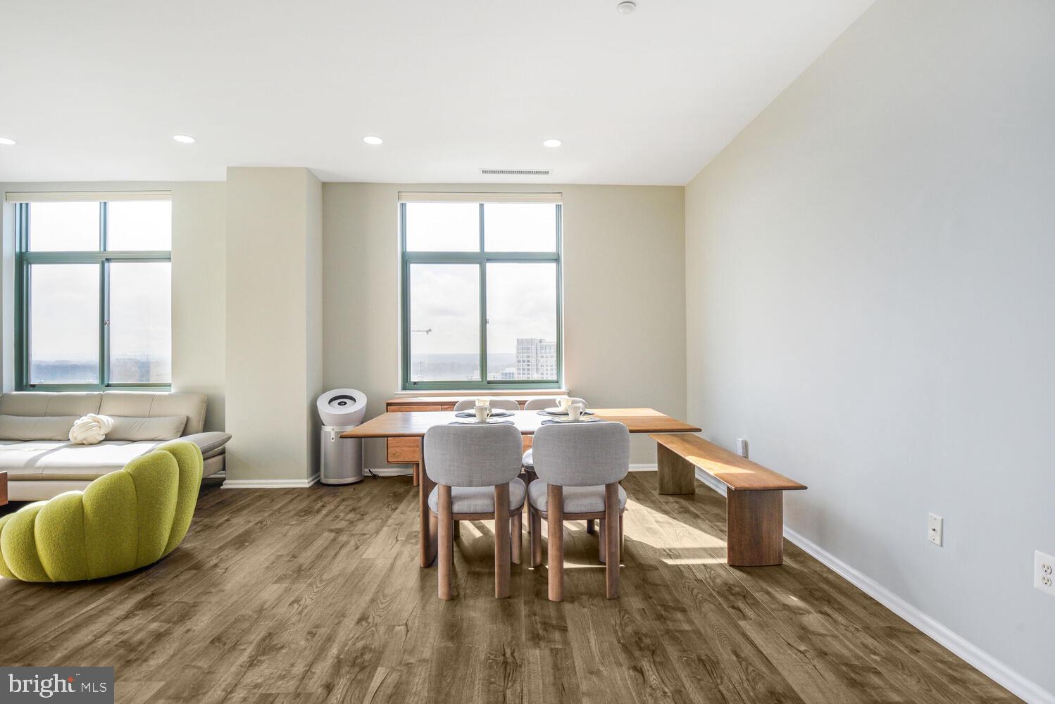 11700 Old Georgetown Road, Unit 1604 North Bethesda, MD 20852 - Photo 2 of 41 a view of a dining room with furniture and wooden floor