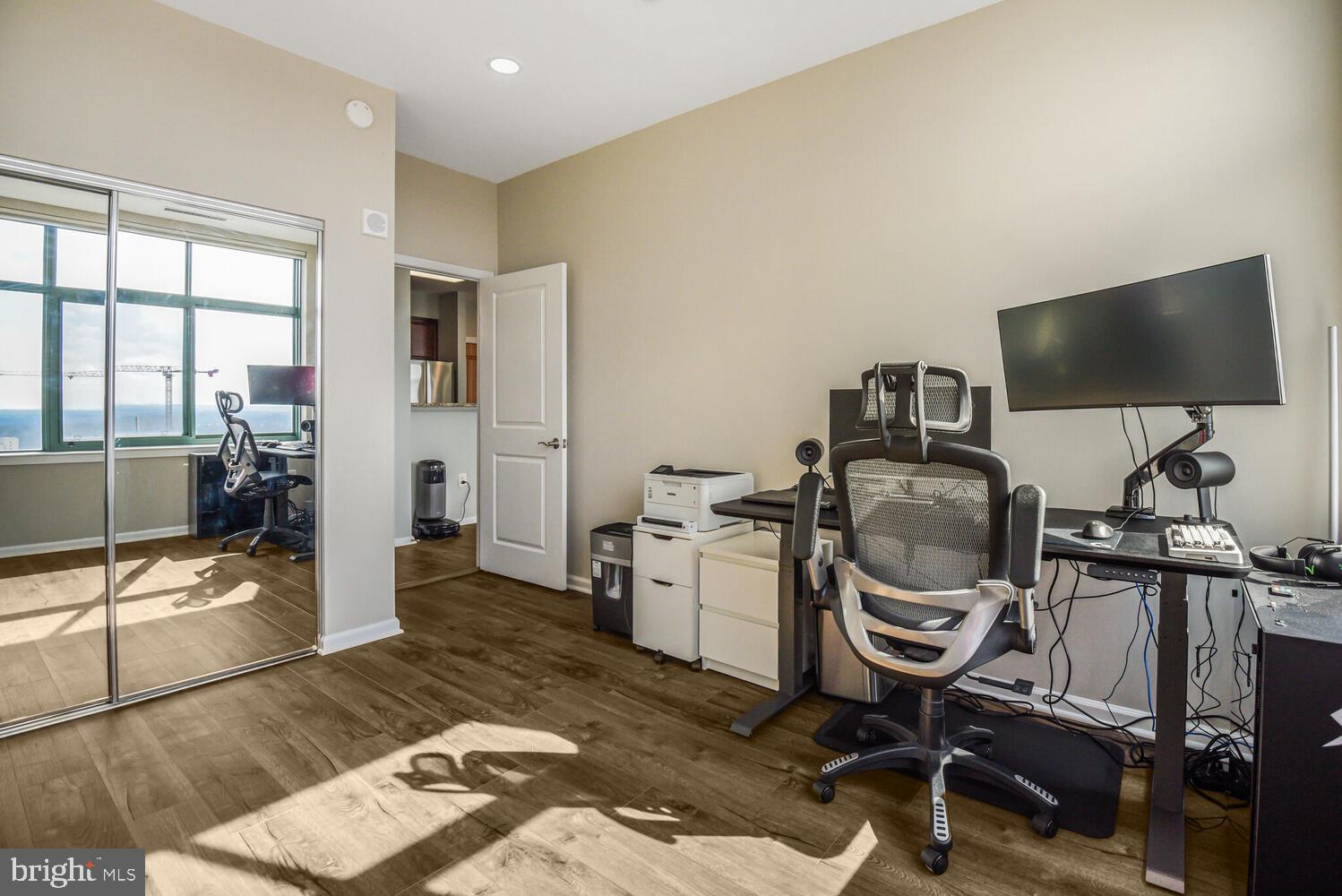 11700 Old Georgetown Road, Unit 1604 North Bethesda, MD 20852 - Photo 21 of 41 a view of a workspace with furniture and a flat screen tv