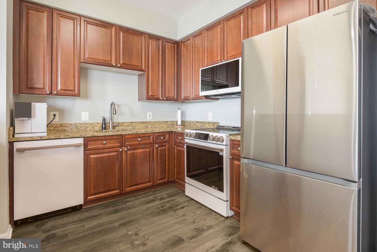 11700 Old Georgetown Road, Unit 1604 North Bethesda, MD 20852 - Photo 10 of 41 a kitchen with a sink a microwave and cabinets