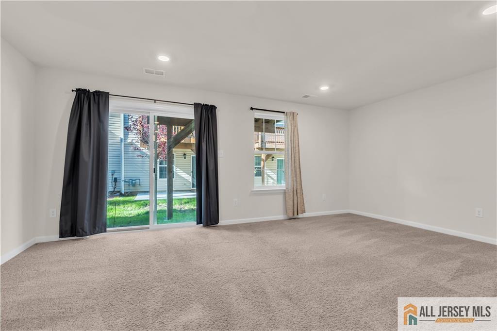 504 East International Road, Unit 504 Monroe Township, NJ 08831 - Photo 17 of 29 a view of livingroom with furniture and front door
