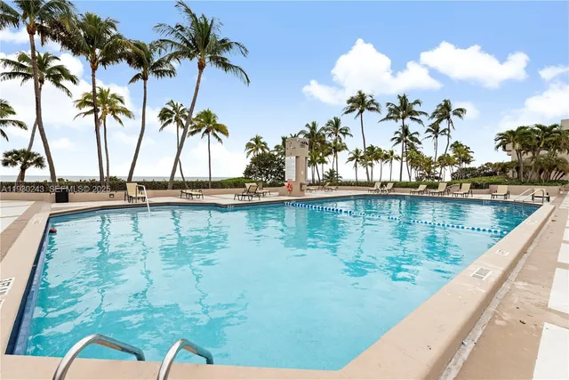 a view of swimming pool with a table and chairs