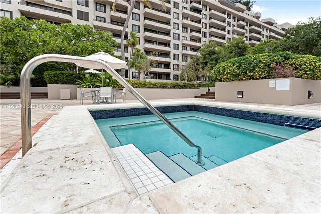 a view of a swimming pool with a lounge chairs