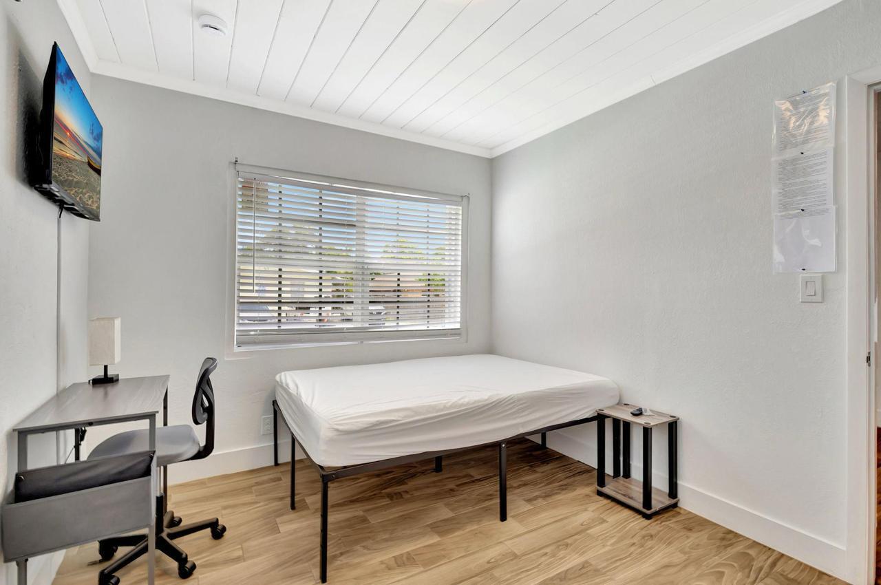 1075 West 30th Street Riviera Beach, FL 33404 - Photo 20 of 66 a view of a livingroom with furniture and a window