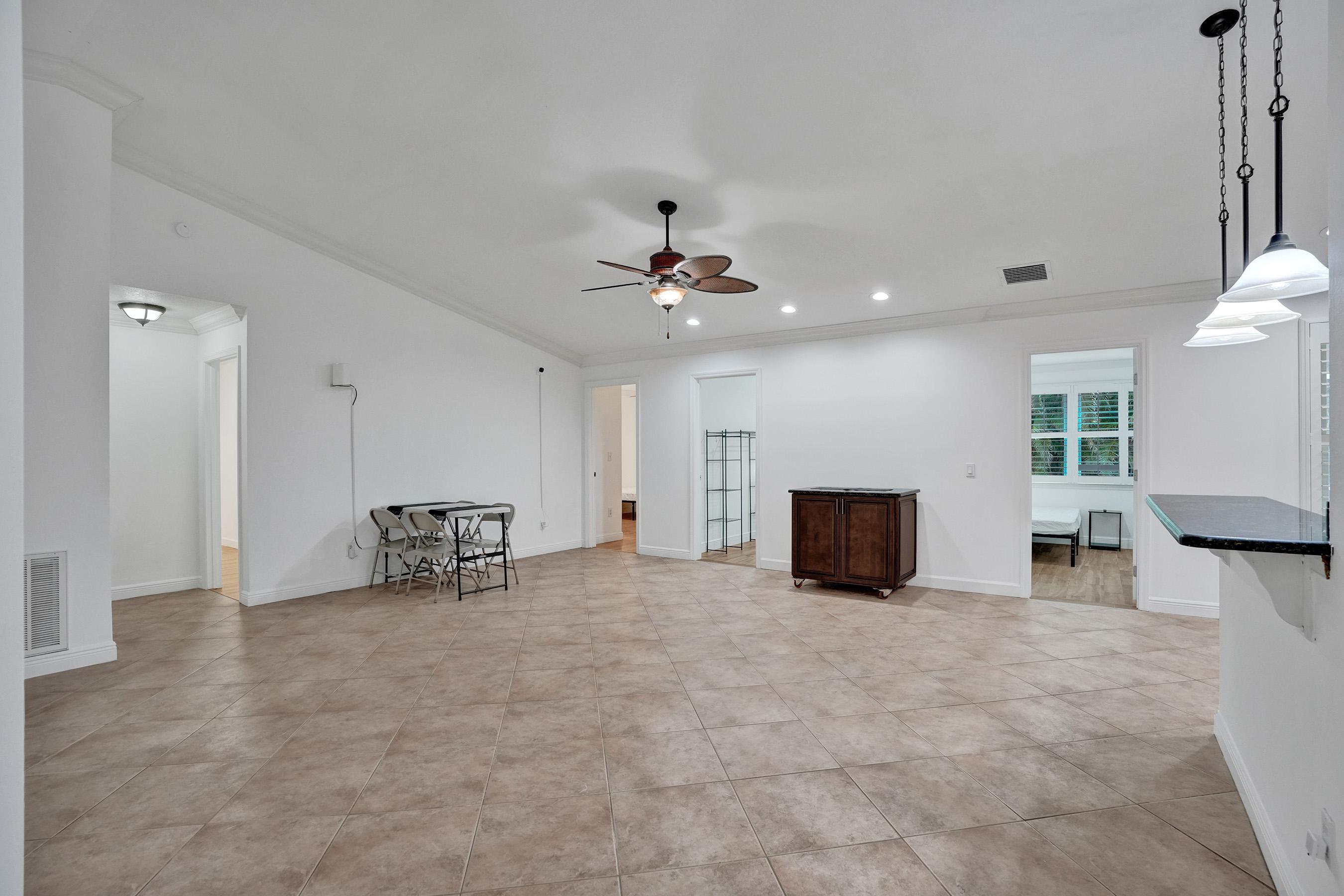1075 West 30th Street Riviera Beach, FL 33404 - Photo 33 of 66 a living room with furniture and a table
