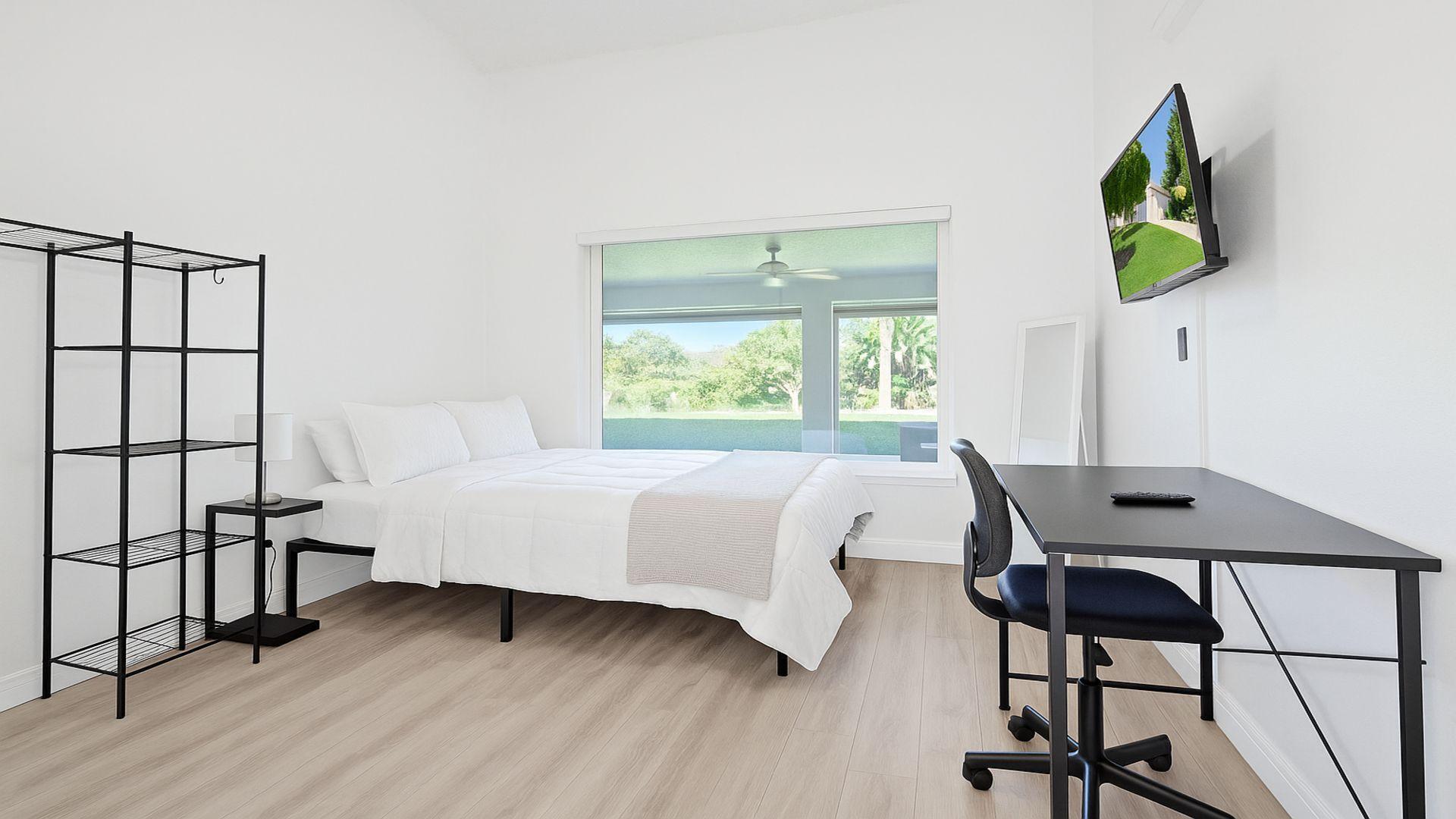 1075 West 30th Street Riviera Beach, FL 33404 - Photo 54 of 66 a bedroom with furniture and a window