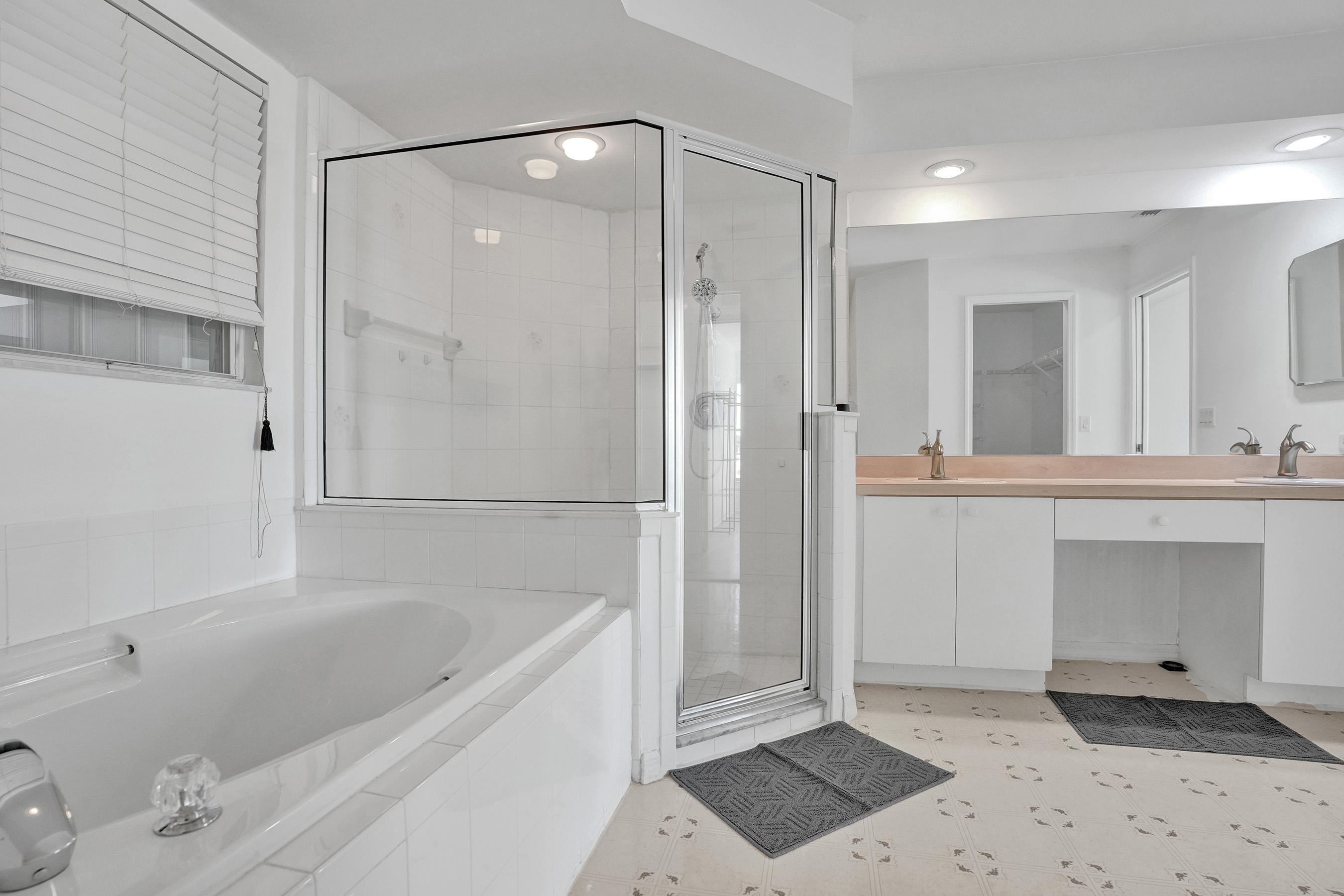 1075 West 30th Street Riviera Beach, FL 33404 - Photo 63 of 66 a bathroom with a bathtub and a shower