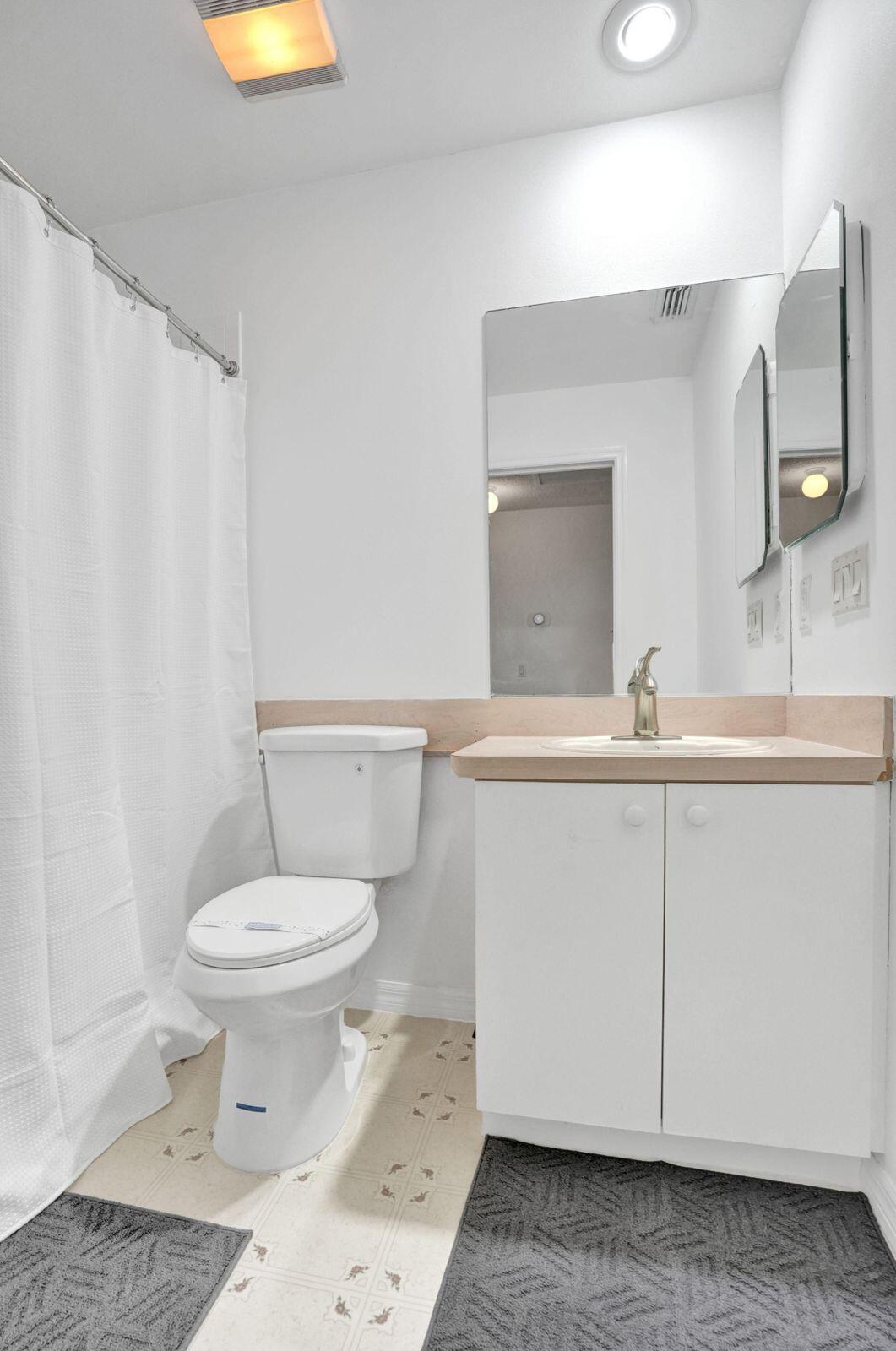 1075 West 30th Street Riviera Beach, FL 33404 - Photo 66 of 66 a bathroom with a sink and a toilet