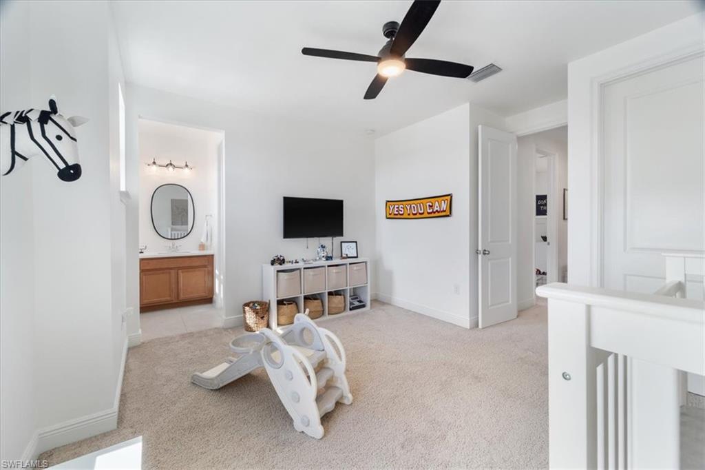 3524 Pilot Circle Naples, FL 34120 - Photo 26 of 30 a living room with furniture and a flat screen tv