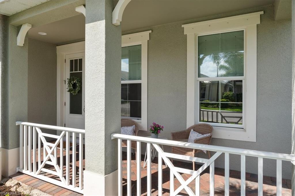 3524 Pilot Circle Naples, FL 34120 - Photo 29 of 30 a view of a porch with a table and chairs