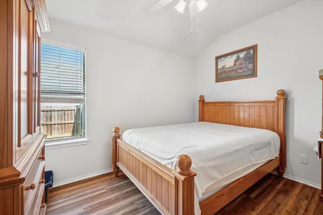 a bedroom with bed and a window