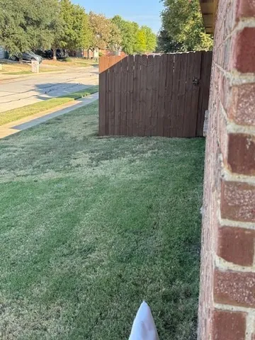 a view of a yard with an outdoor space and seating area