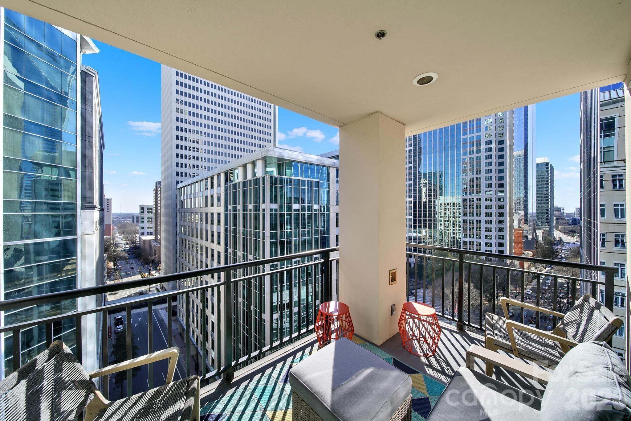 230 South Tryon Street, Unit 1004 Charlotte, NC 28281 - Photo 2 of 39 a living room with furniture
