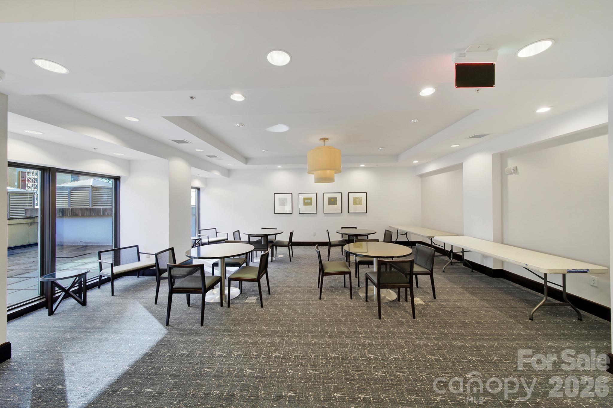 230 South Tryon Street, Unit 1004 Charlotte, NC 28281 - Photo 29 of 39 a view of a dining room with furniture