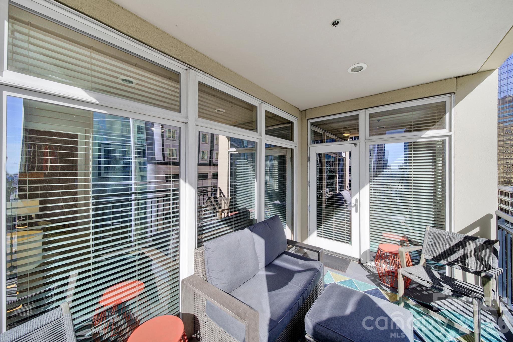 230 South Tryon Street, Unit 1004 Charlotte, NC 28281 - Photo 3 of 39 a view of deck with patio