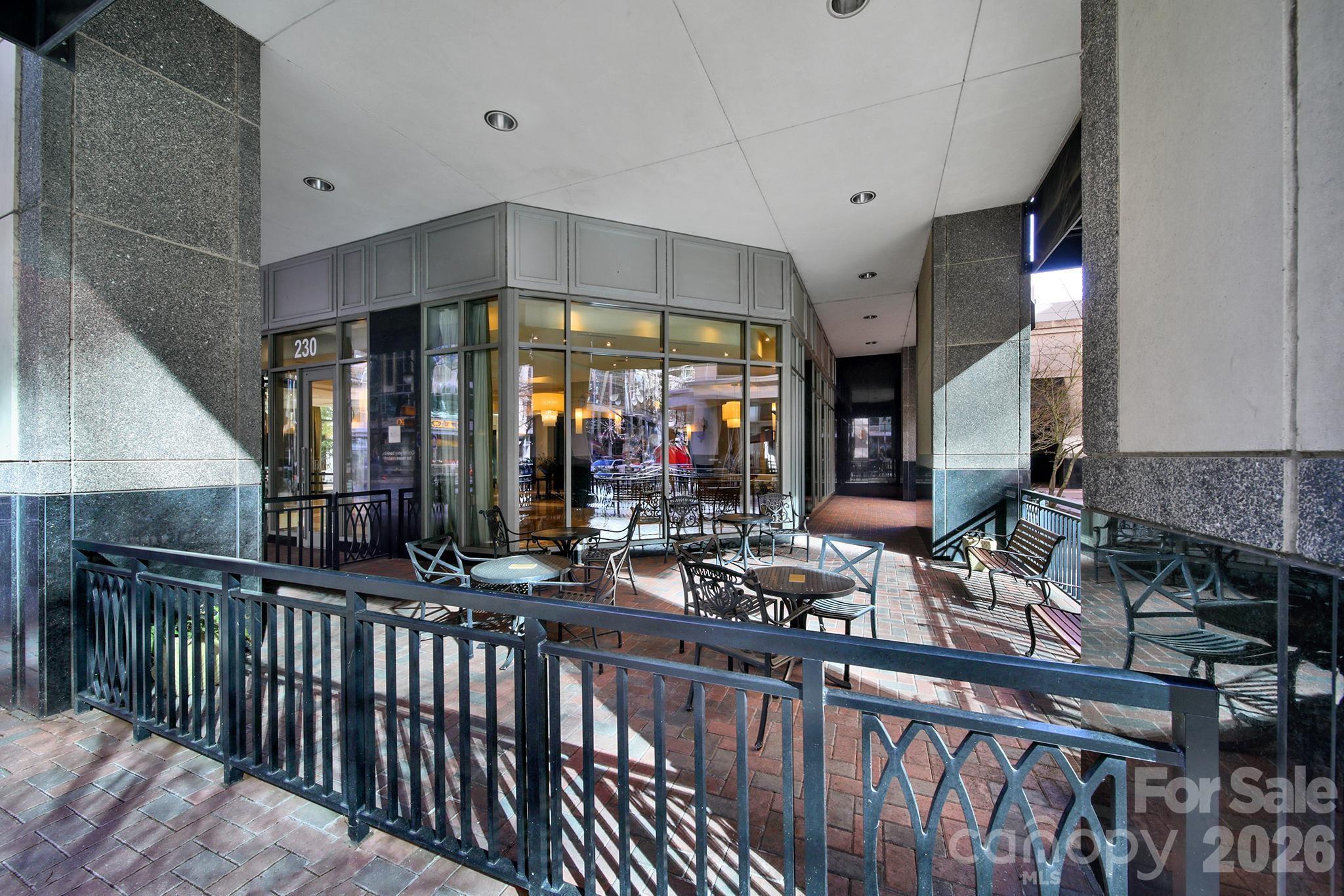 230 South Tryon Street, Unit 1004 Charlotte, NC 28281 - Photo 37 of 39 a view of a living room and balcony