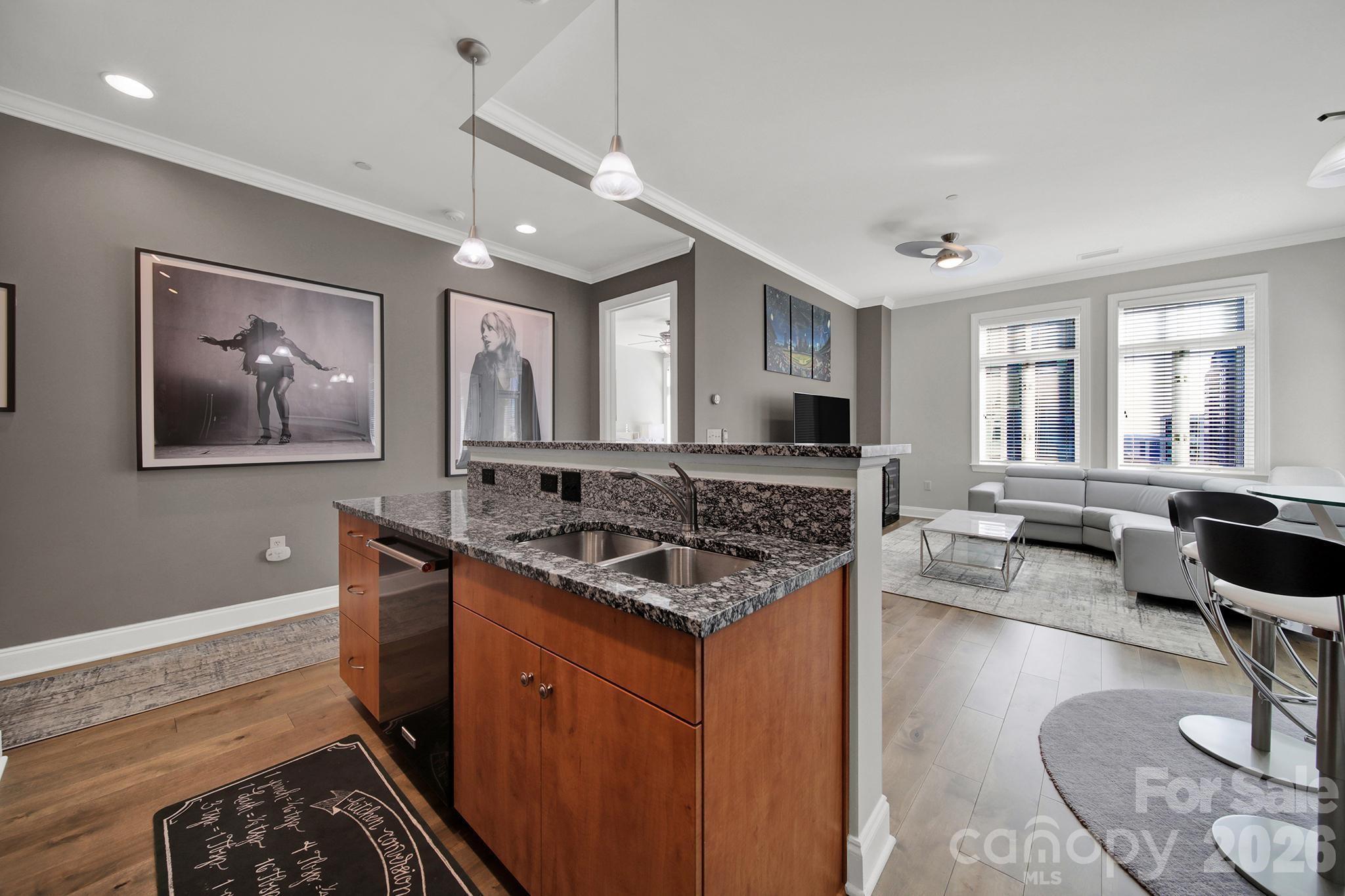 230 South Tryon Street, Unit 1004 Charlotte, NC 28281 - Photo 7 of 39 a kitchen with a stove and a refrigerator