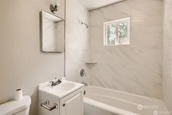 a bathroom with a sink toilet and vanity