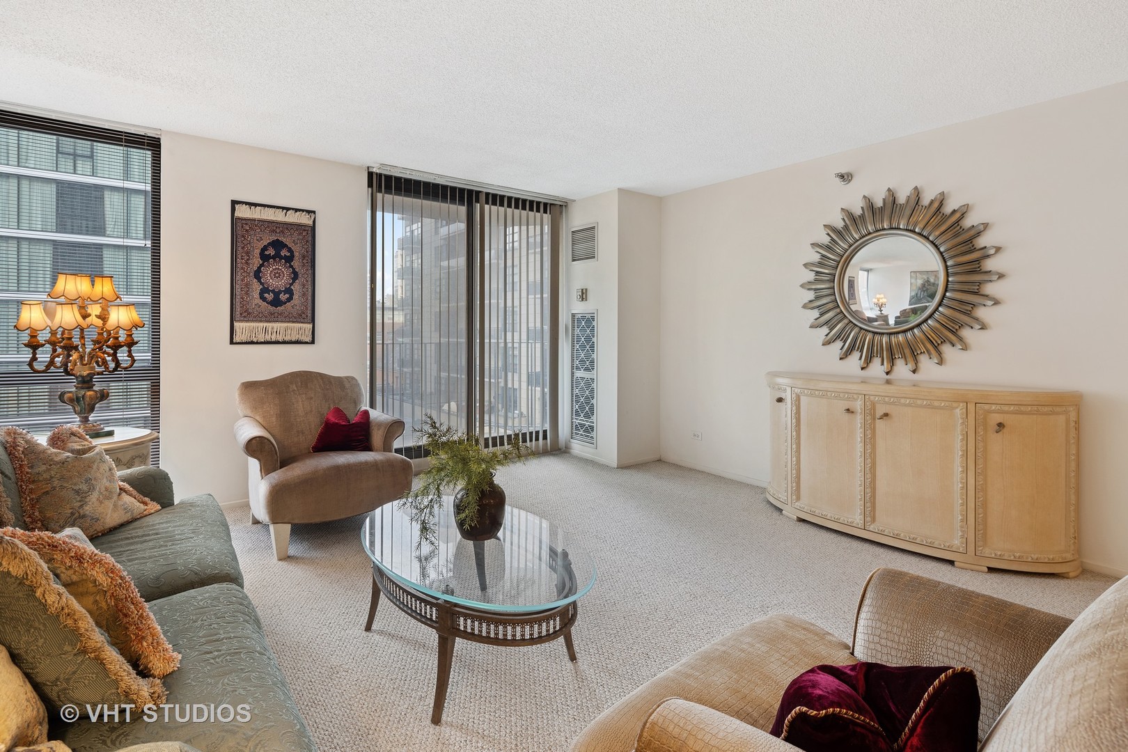 70 West Huron Street, Unit 705 Chicago, IL 60654 - Photo 11 of 16 a living room with furniture a rug and wall paintings