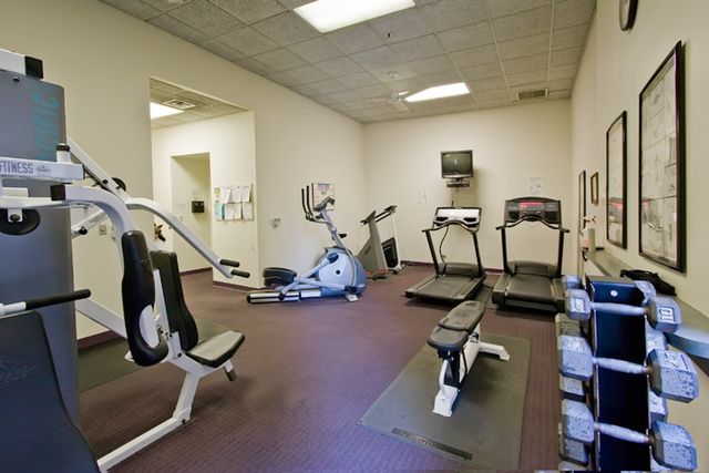 a swimming pool with outdoor seating