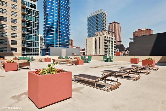 70 West Huron Street, Unit 705 Chicago, IL 60654 - Photo 16 of 16 a swimming pool with outdoor seating