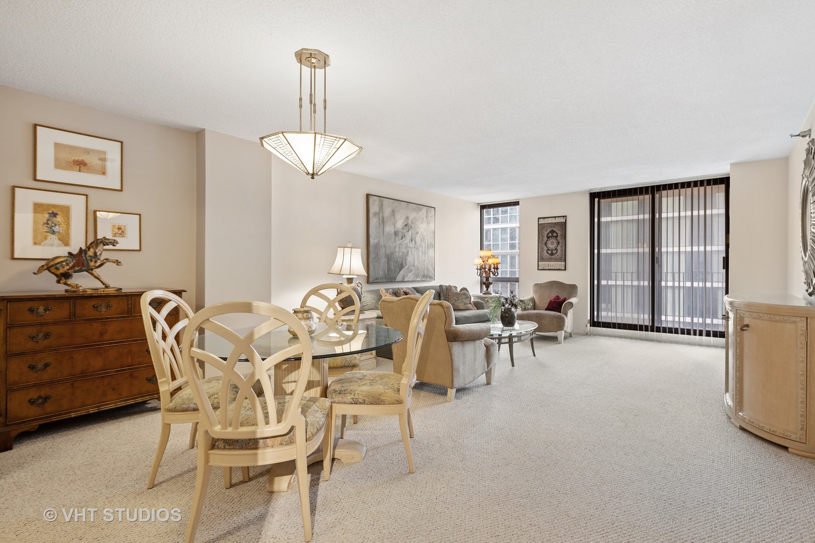 70 West Huron Street, Unit 705 Chicago, IL 60654 - Photo 3 of 16 a view of a dining room with furniture window and outside view