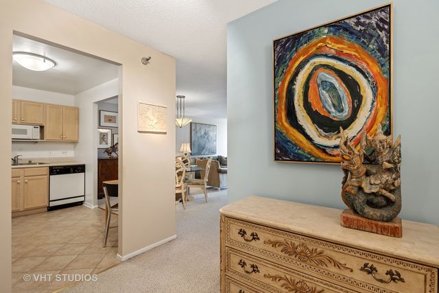 a kitchen with stainless steel appliances a stove microwave and cabinets