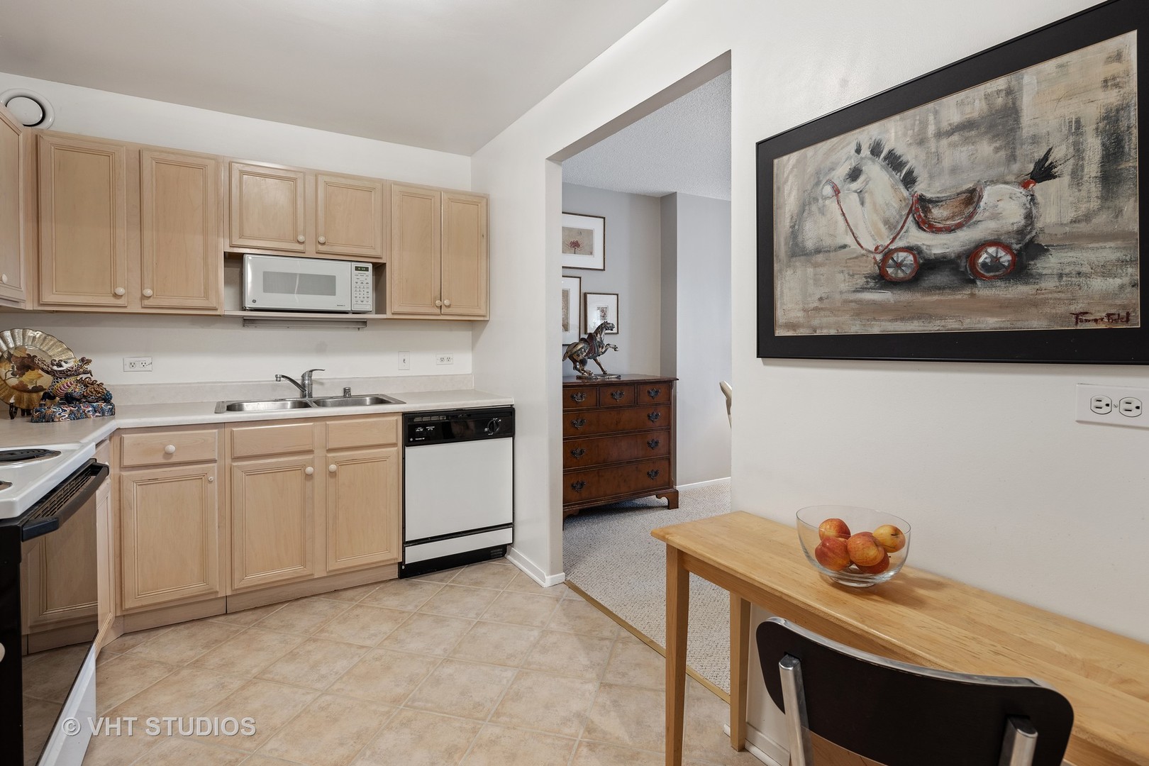 70 West Huron Street, Unit 705 Chicago, IL 60654 - Photo 7 of 16 a kitchen with stainless steel appliances a stove microwave and cabinets