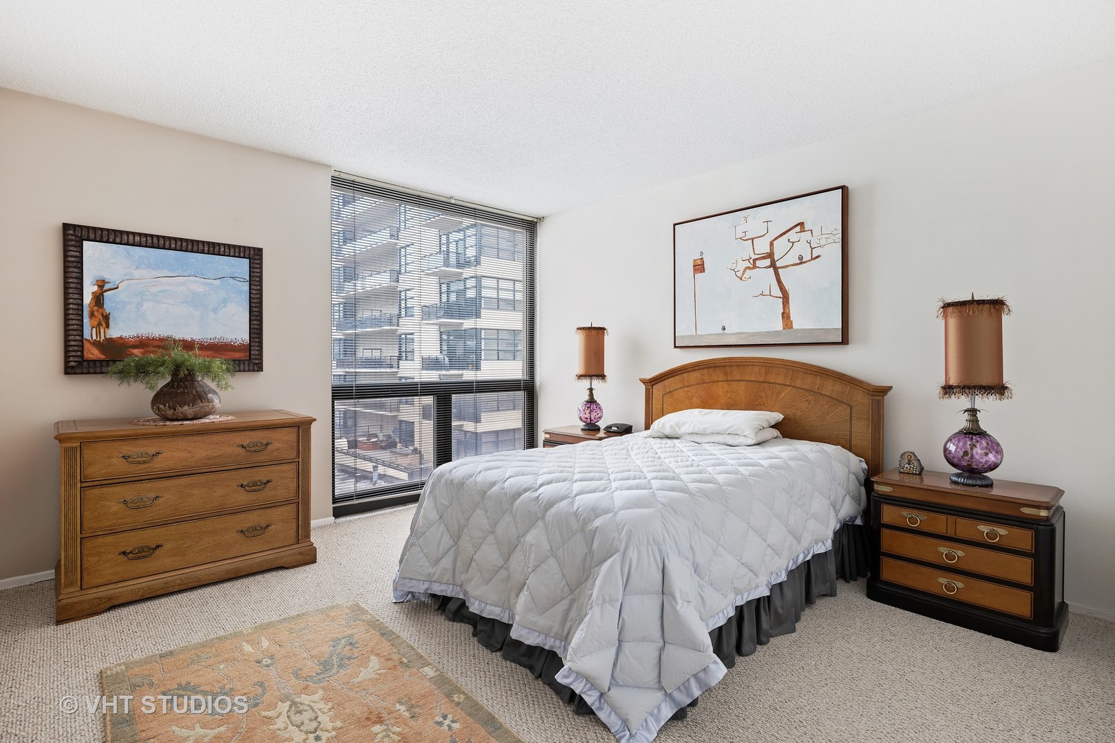 70 West Huron Street, Unit 705 Chicago, IL 60654 - Photo 9 of 16 a bedroom with a bed and a window