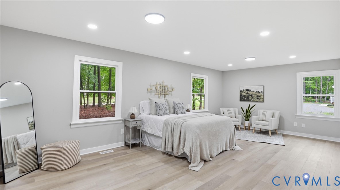 3200 Portugee Road Sandston, VA 23150 - Photo 4 of 26 a bedroom with a bed and wooden floor