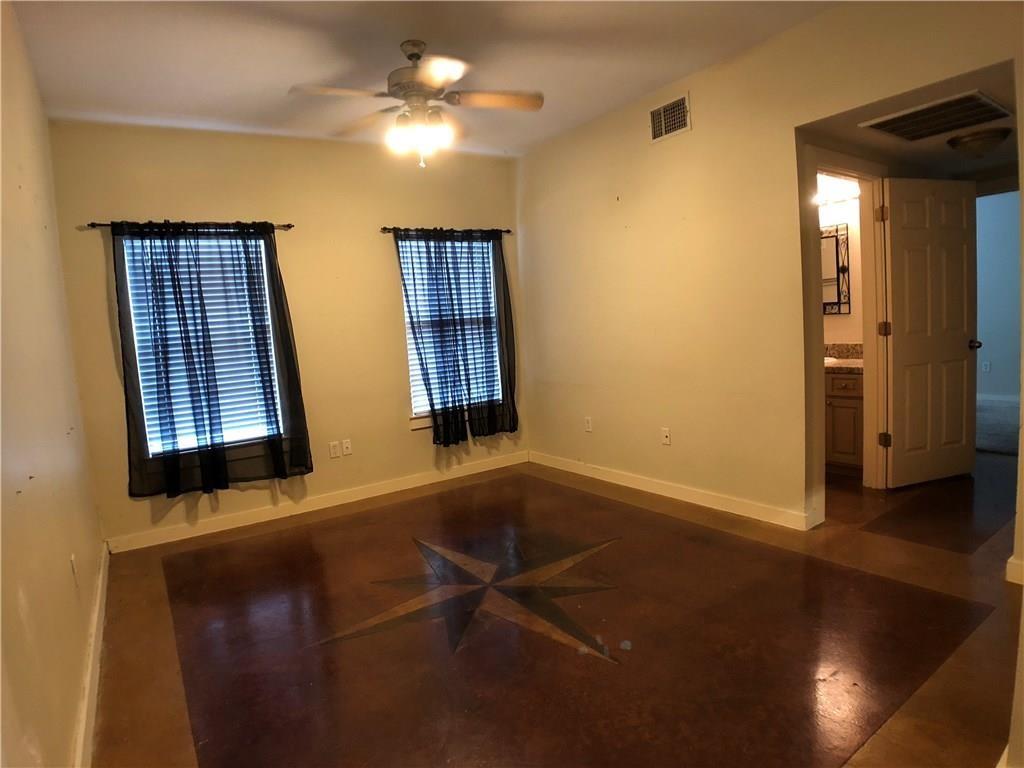 2106 Cullen Avenue, Unit 111 Austin, TX 78757 - Photo 6 of 6 Spare room with baseboards and a ceiling fan