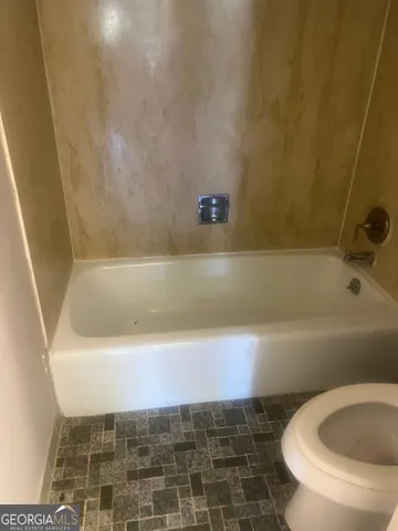 a bathroom with a bathtub