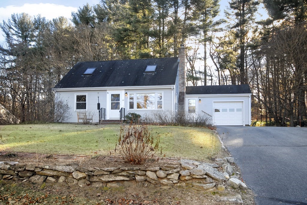 82 Powers Road Concord, MA 01742 - Photo 1 of 35 a front view of a house with a yard