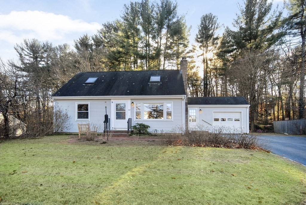 82 Powers Road Concord, MA 01742 - Photo 14 of 35 a front view of house with yard and trees in the background