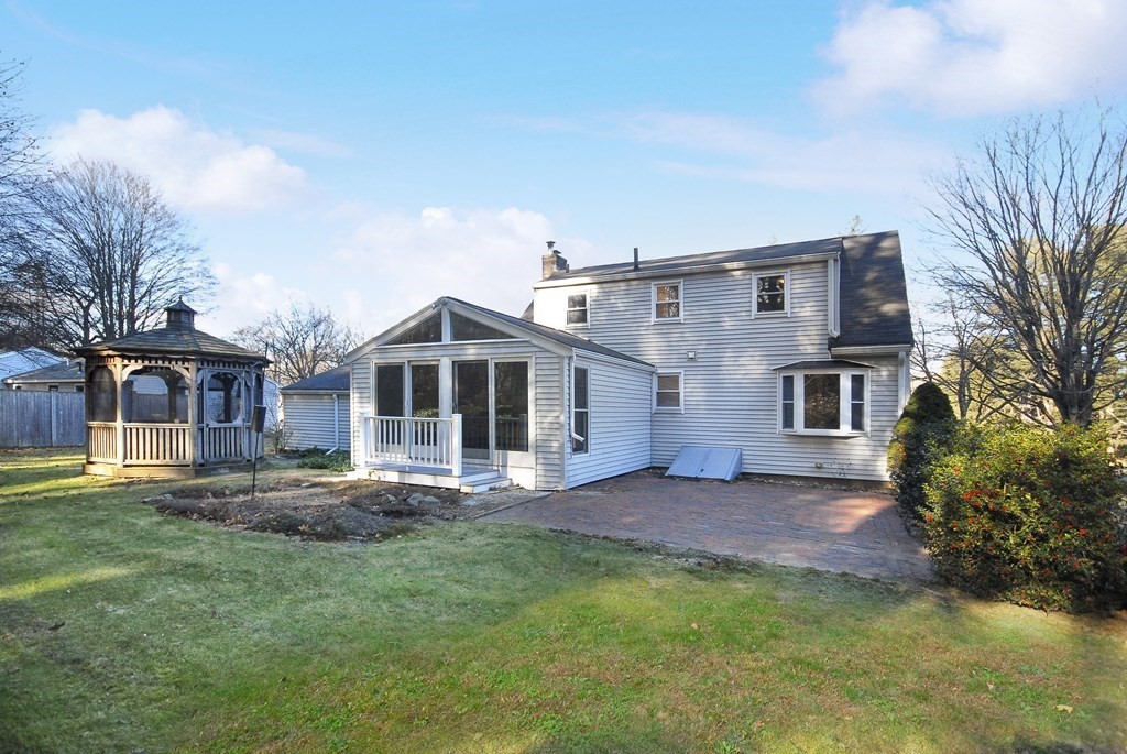 82 Powers Road Concord, MA 01742 - Photo 15 of 35 a front view of a house with a yard