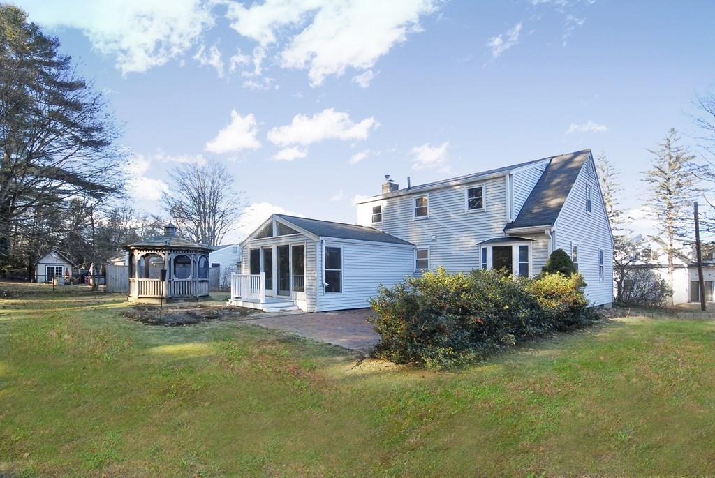 82 Powers Road Concord, MA 01742 - Photo 16 of 35 a front view of house with yard and trees