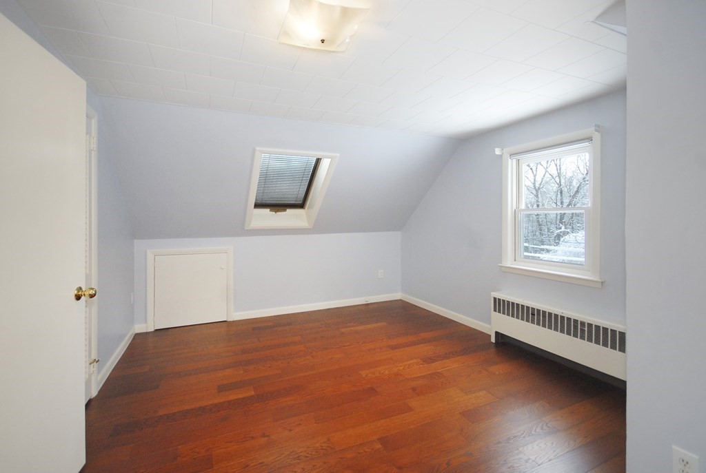 82 Powers Road Concord, MA 01742 - Photo 23 of 35 a view of a room with wooden floor and window